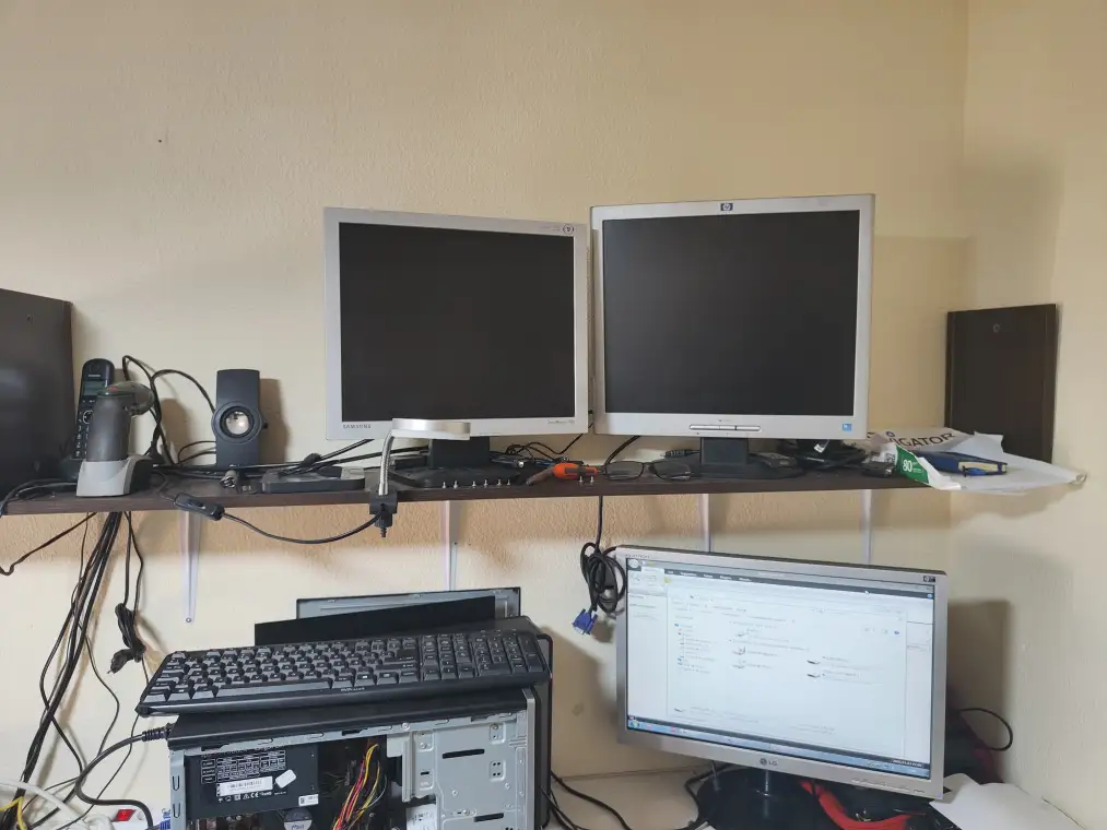Workshop workbench with computers under repair